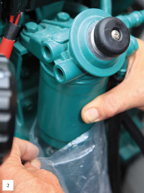 Replacing a spin-on filter.